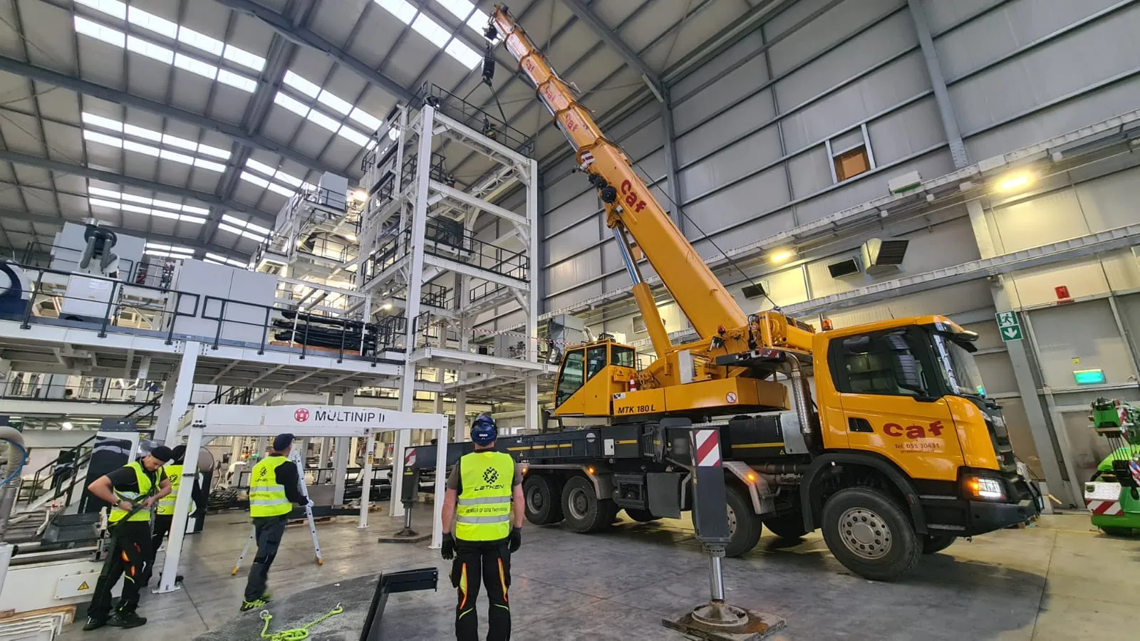 Truck crane working on a multi-level production structure